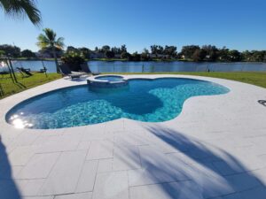Backyard pool with spa overlooking lake view